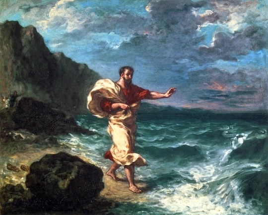 a man in classical clothing walking by the seashore